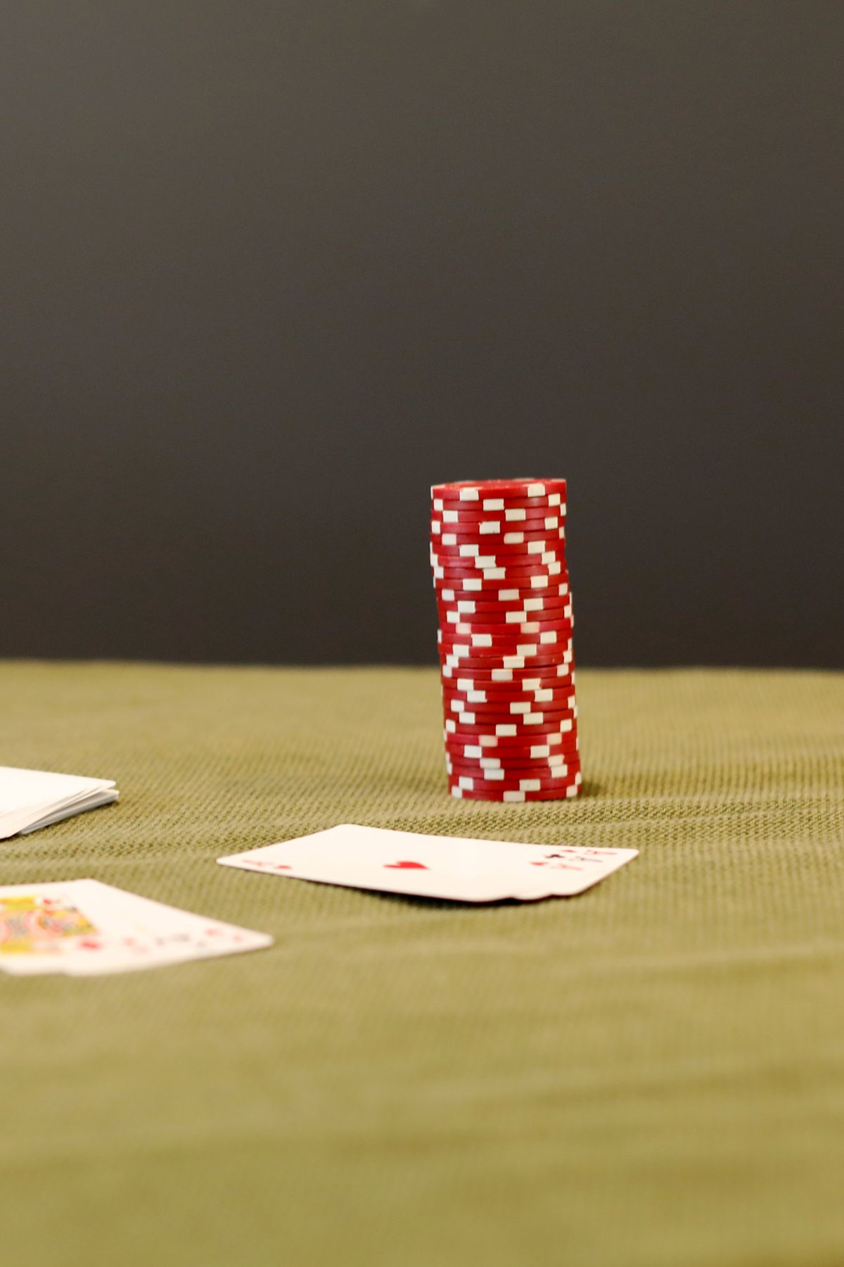Dice and casino chips on a green felt table