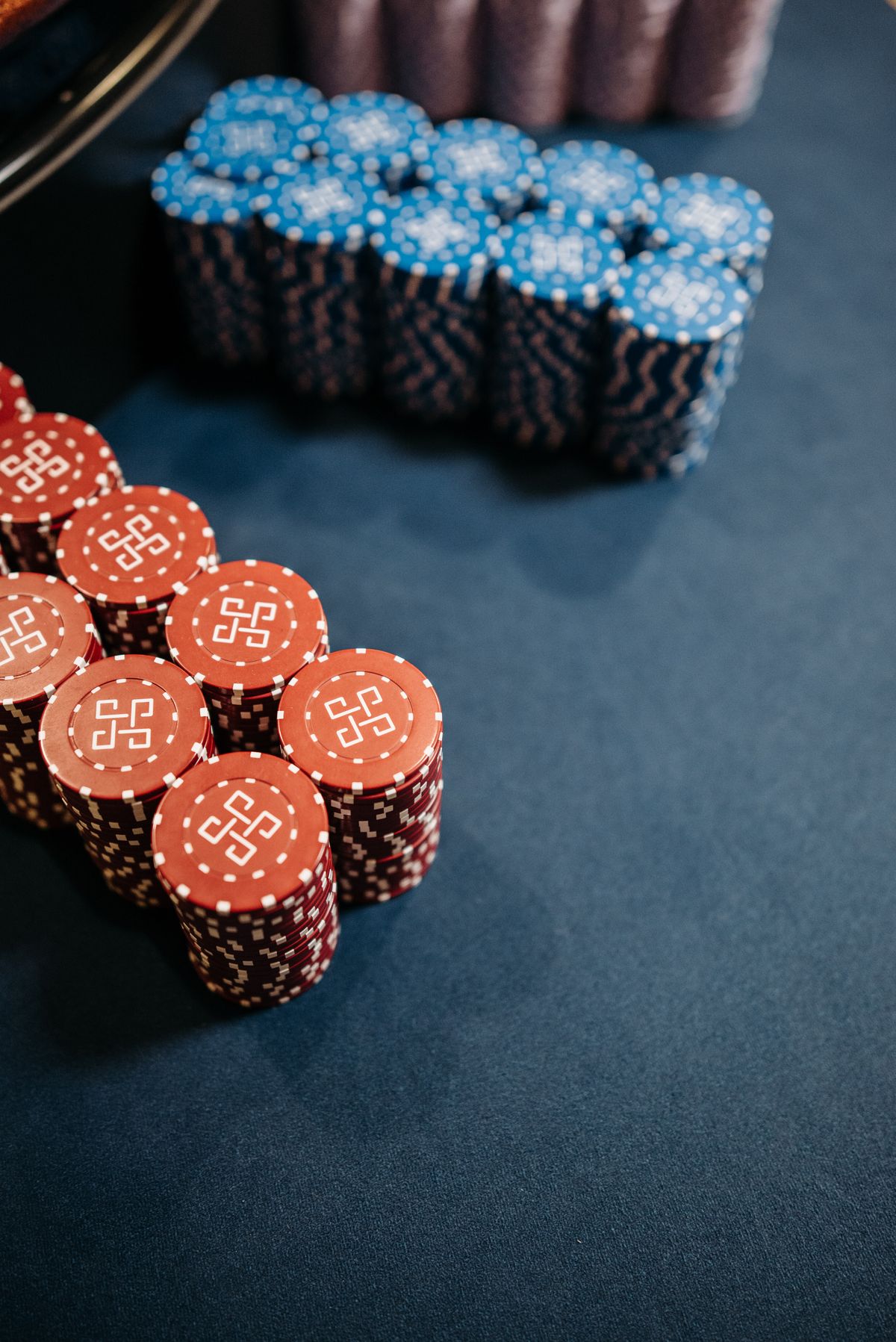 Close-up of playing cards and poker chips